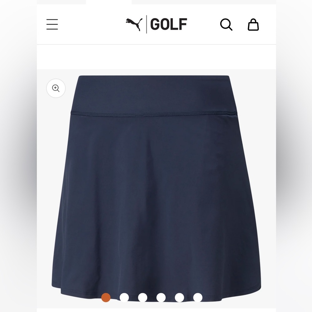 Navy blue golf skort 18”, size XS. Never worn. 50+ UPF.